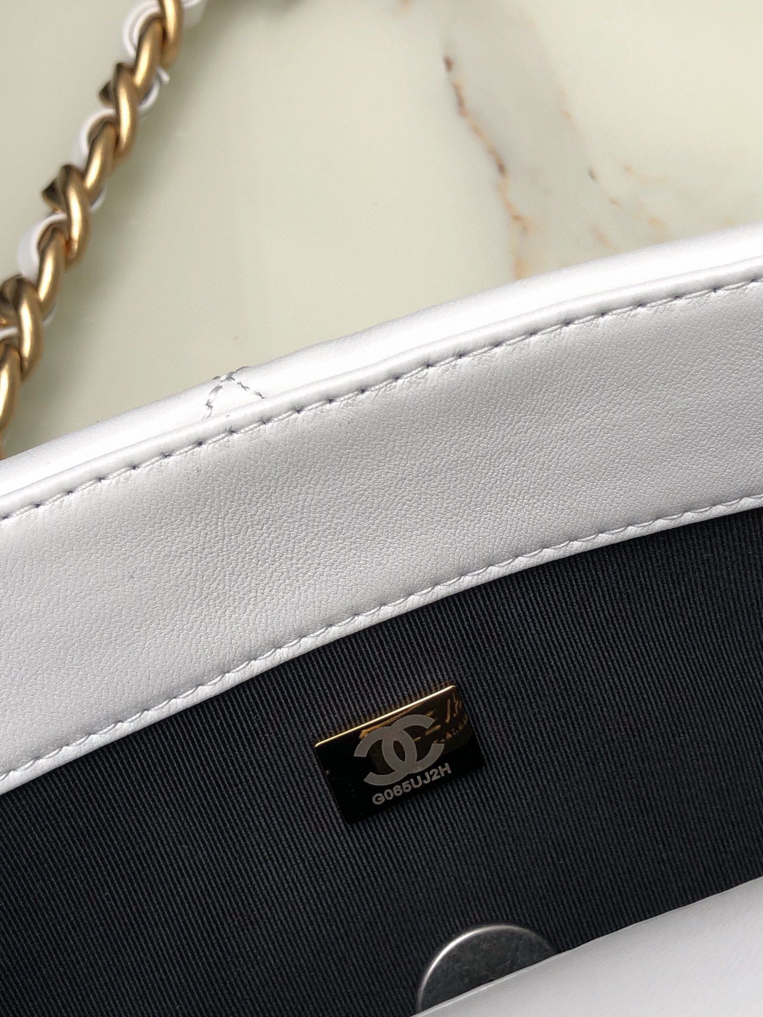 Ch*el 19 large handbag shiny leather, gold-tone, silver-tone & ruthenium-finish metal white 7.8 × 11.7 × 3.9 in