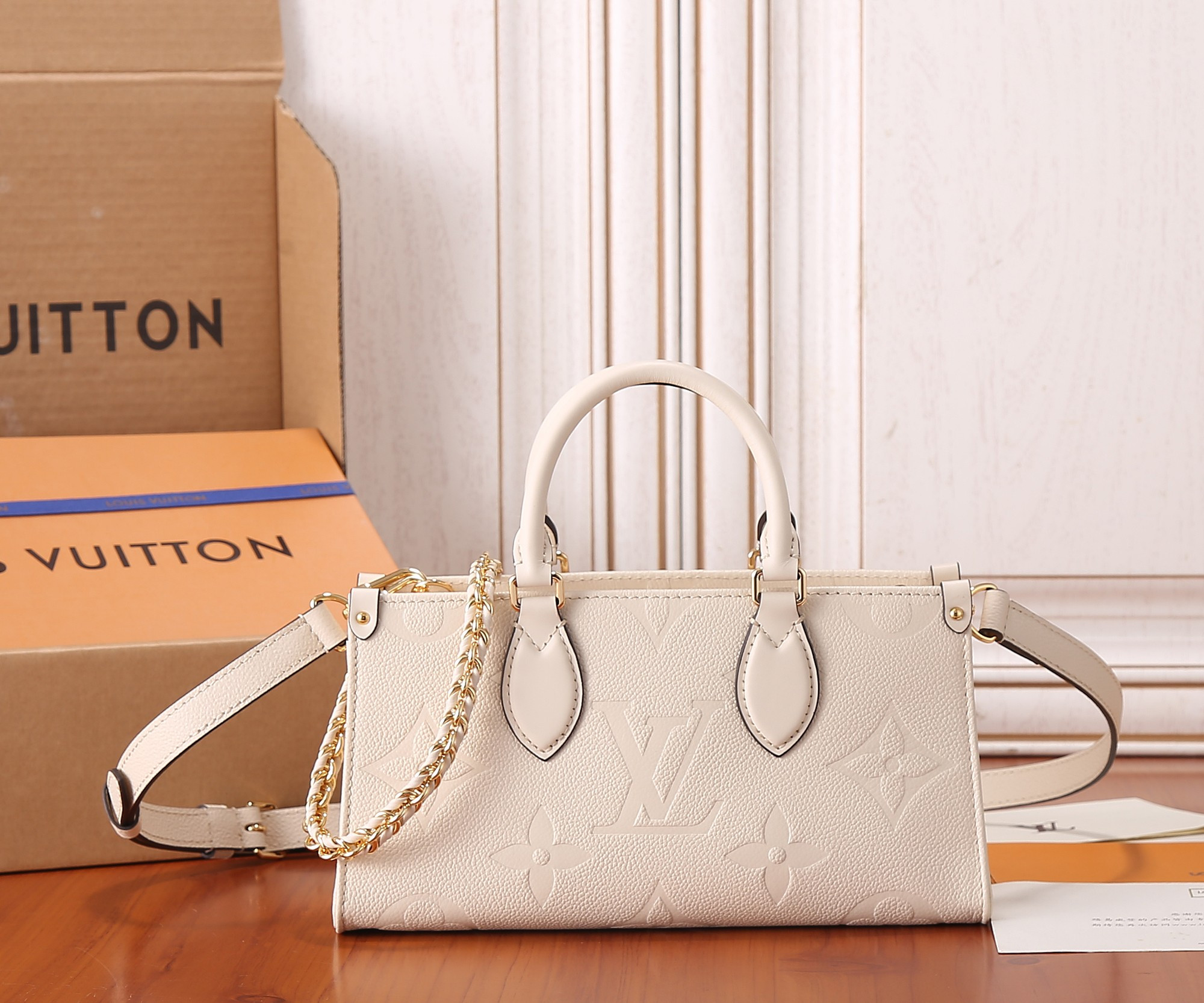 LV OnTheGo East West M23698 9.8 x 5.1 x 3.9 inches