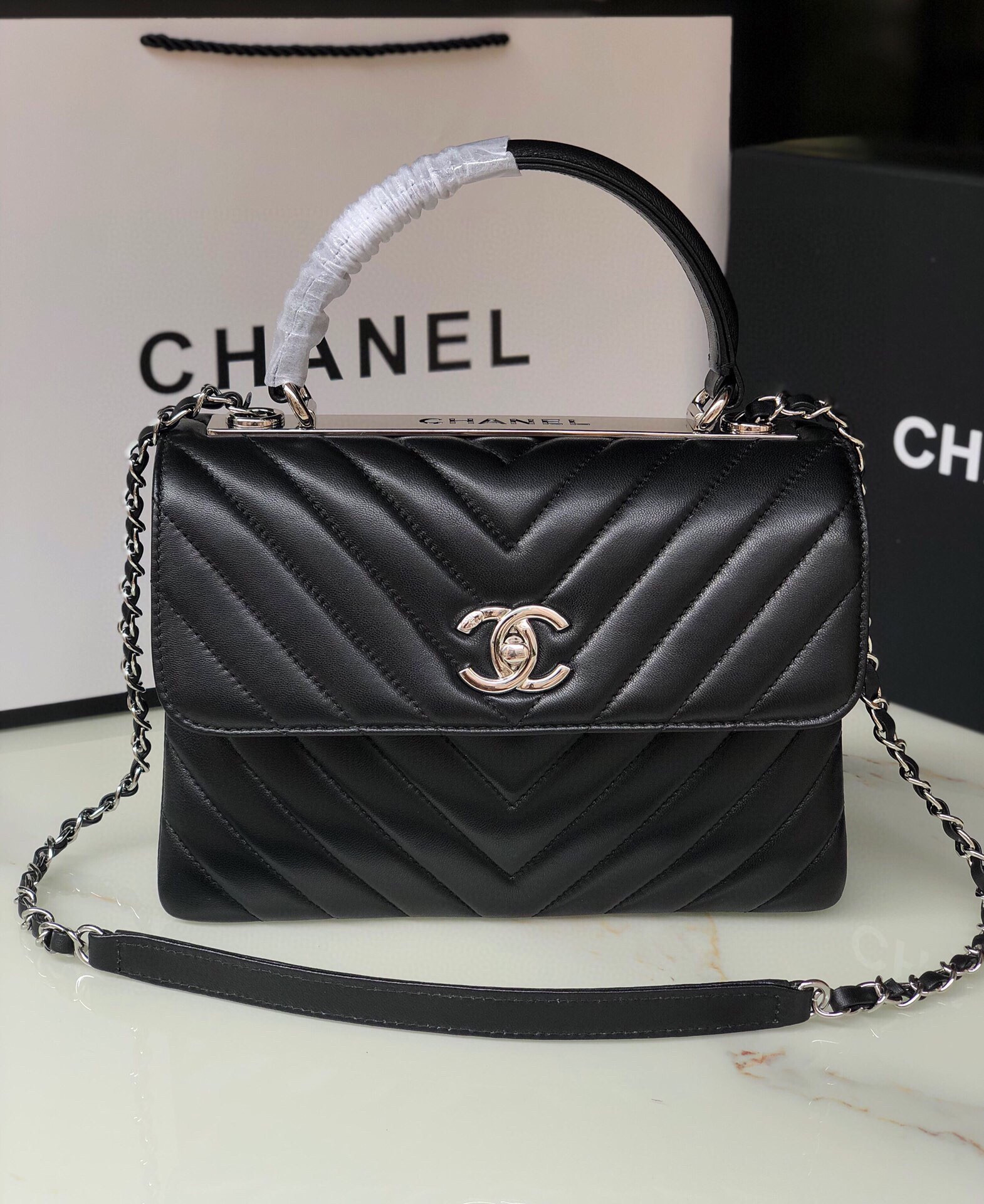 Ch*el flap bag with top handle 6.6 × 9.8 × 4.7 in
