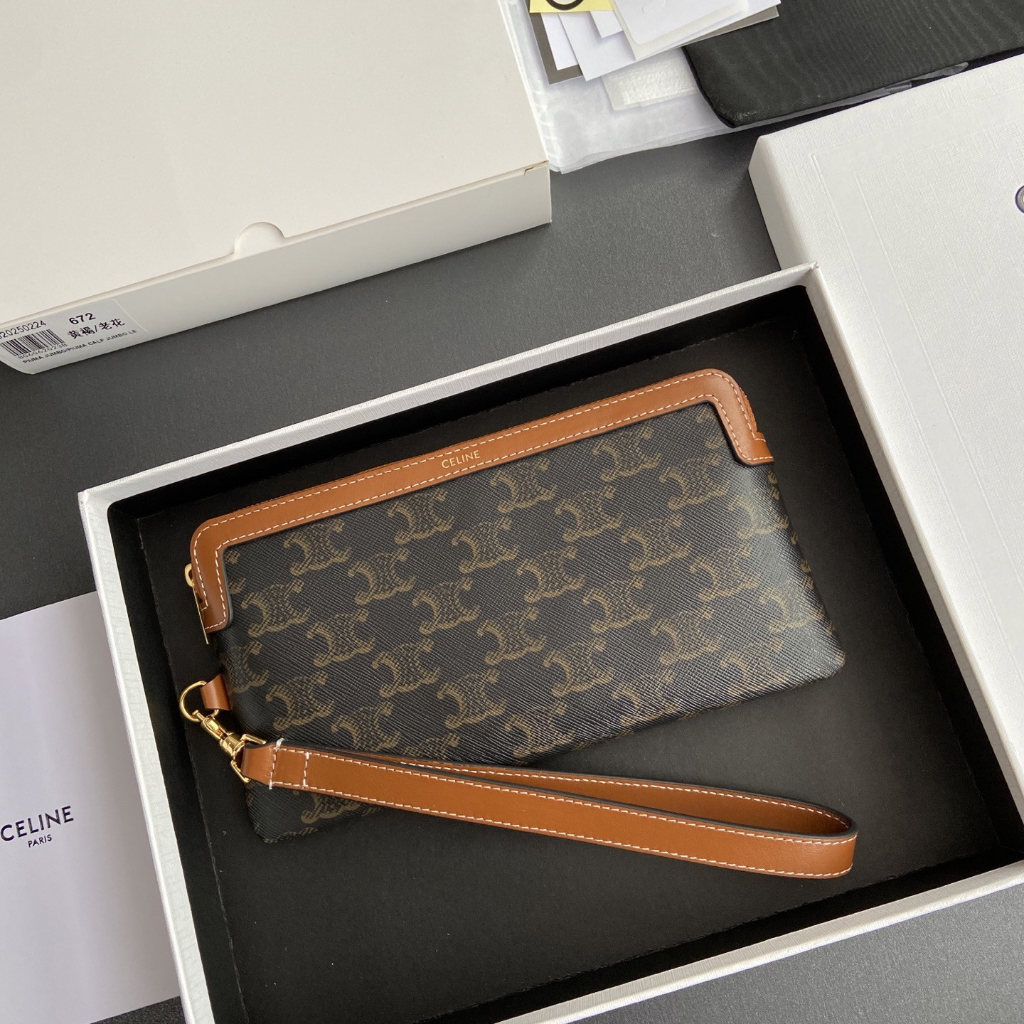 Ce**e long pouch with strap in triomphe canvas and calfskin 21.5x11.5x1cm